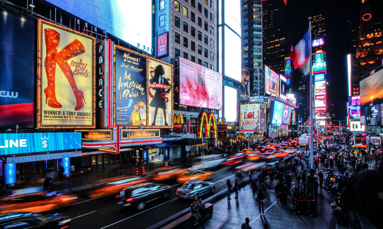 people walking on street during night time